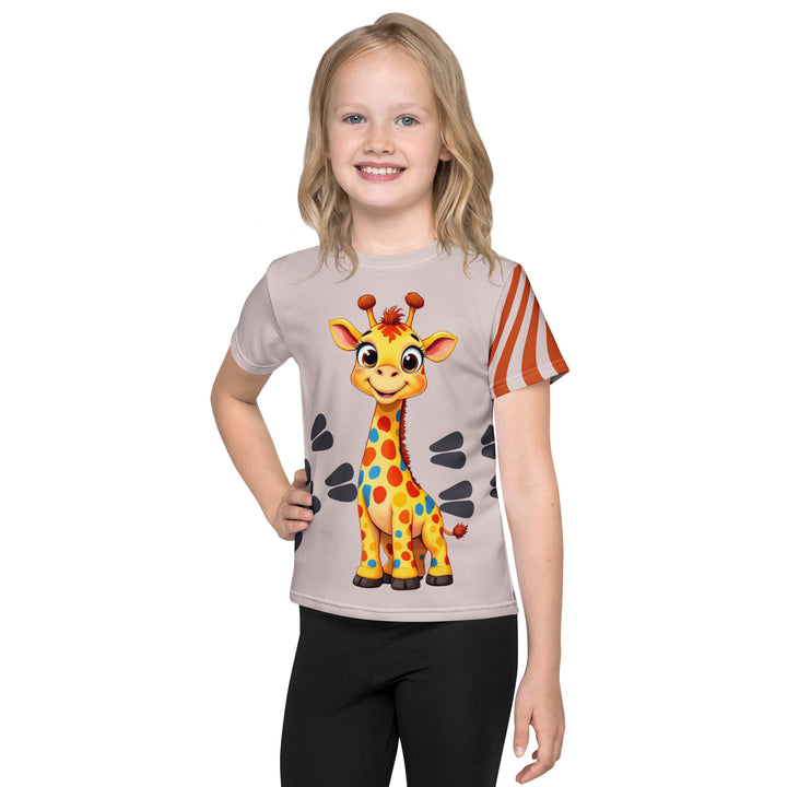 Giraffe Path Girls T-shirt, cream background with a smiling yellow giraffe featuring colorful polka dots on the front, dark gray giraffe paw prints behind, and brown-orange wavy lines on the left sleeve, front view on model