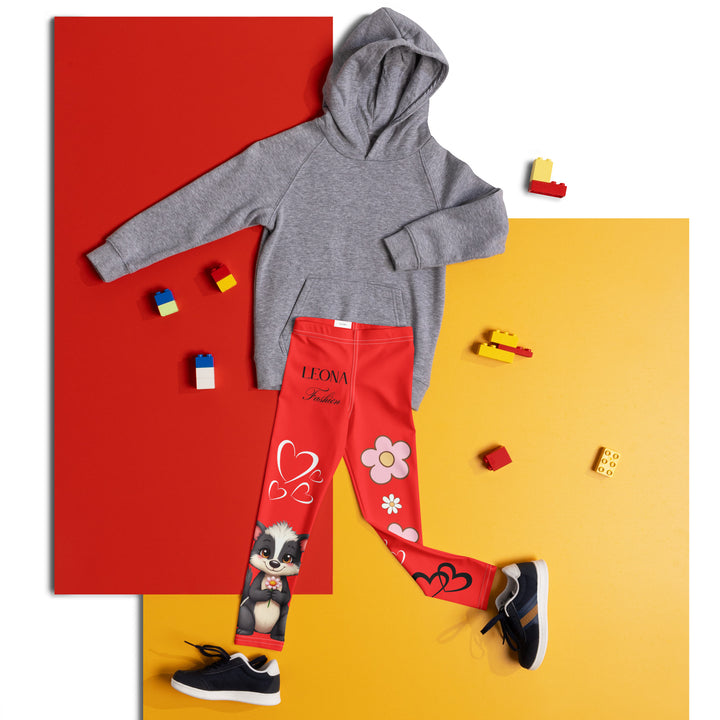 Heart Stinker Girls Leggings, red background with a black and white skunk holding a white flower in its hand, featuring white hearts and pink-and-white floral elements, front view laid flat on floor-with a visible 'Leona Fashion' text on the design