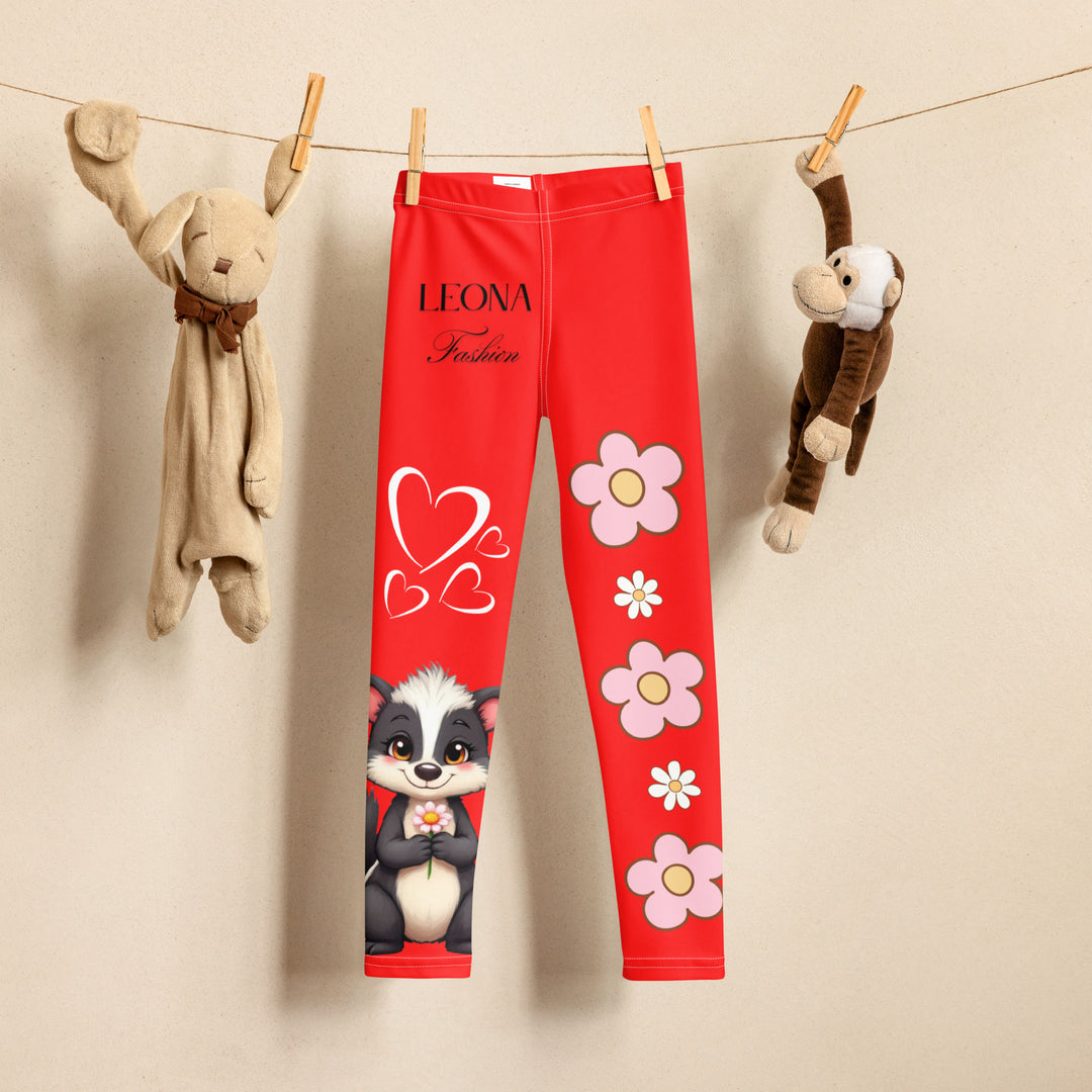 Heart Stinker Girls Leggings, red background with a black and white skunk holding a white flower in its hand, featuring white hearts and pink-and-white floral elements, front view on hanger-with a visible 'Leona Fashion' text on the design