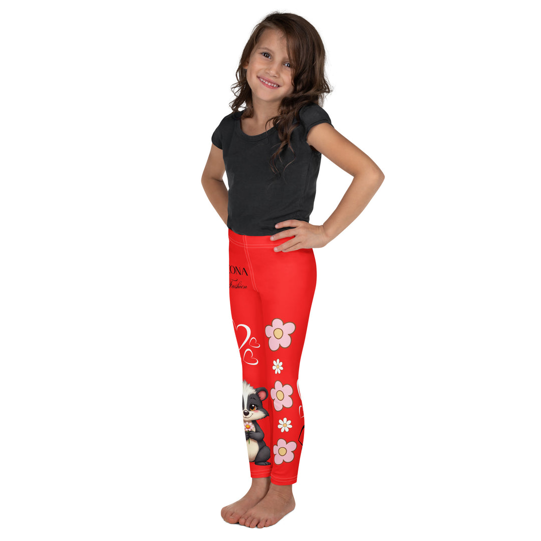  Heart Stinker Girls Leggings, red background with a black and white skunk holding a white flower in its hand, featuring white hearts and pink-and-white floral elements, left side view on model-with a visible 'Leona Fashion' text on the design