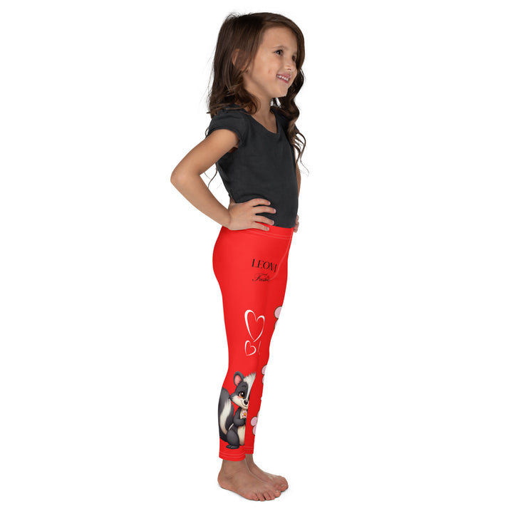Heart Stinker Girls Leggings, red background with a black and white skunk holding a white flower in its hand, featuring white hearts and pink-and-white floral elements, right side view on model-with a visible 'Leona Fashion' text on the design