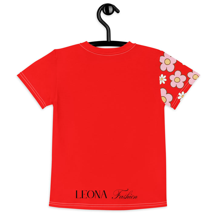 Heart Stinker Girls T-shirt, red background with a black and white skunk holding a white flower in its hand, black and white hearts and a white flower above, and pink-and-white floral details on the right sleeve, back view on hanger-with a visible 'Leona Fashion' text on the design