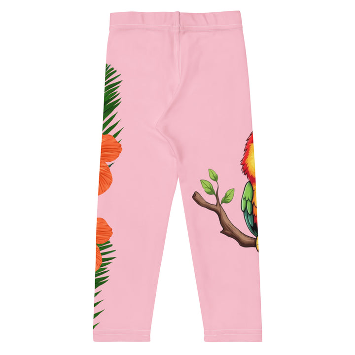 Jungle Parrot Girls Leggings, light pink background with a red, yellow, orange, and green parrot standing on a branch on one leg, and green jungle leaves with two large orange flowers running down the other leg, back view