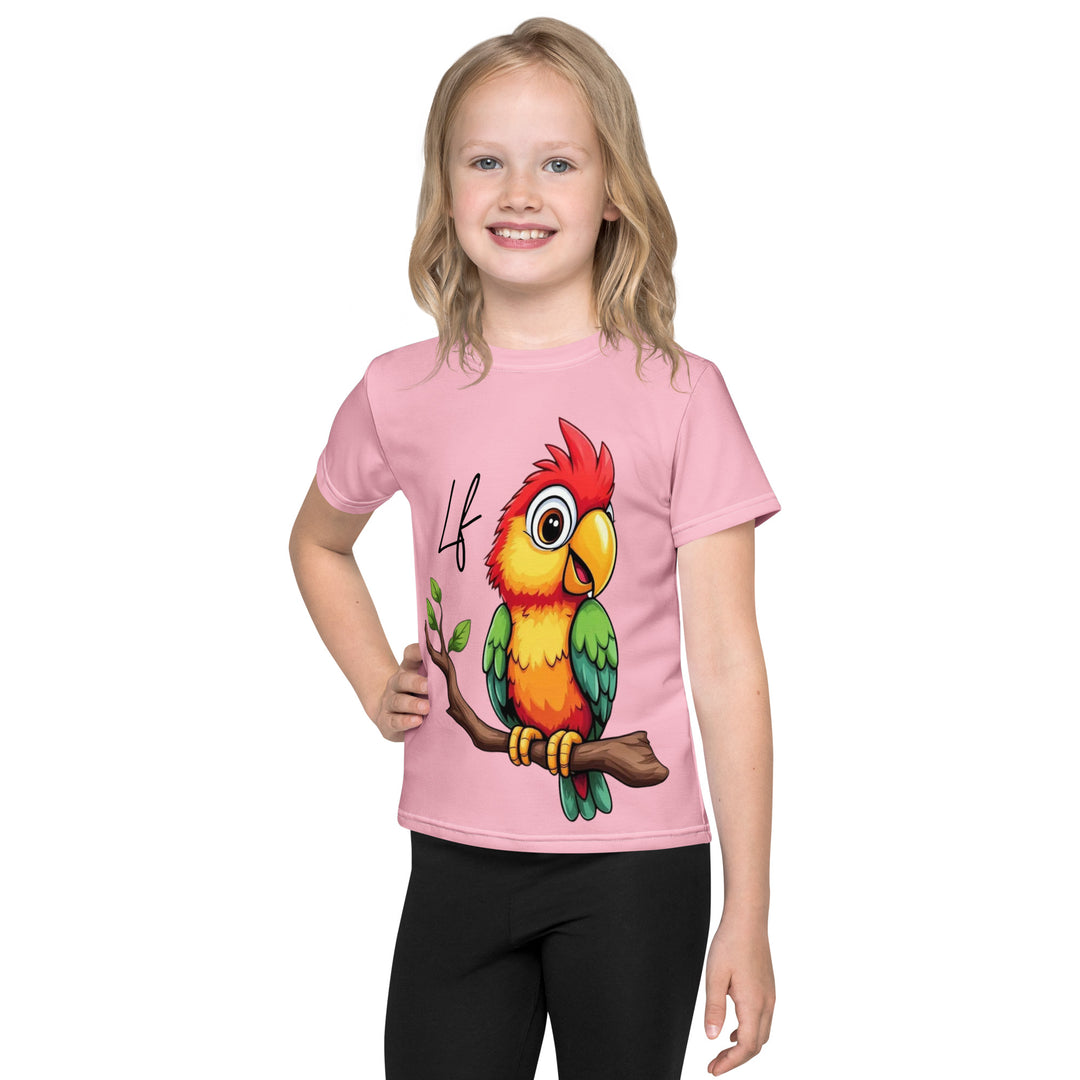 Jungle Parrot Girls T-shirt, light pink background with a red, yellow, orange, and green parrot standing on a branch on the front, front view on model