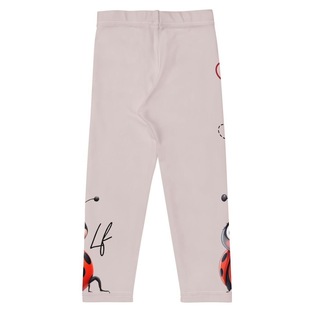 Lovebugs Girls Leggings, sand-colored background with a female ladybug with big eyes at the bottom of one leg and a male ladybug looking delighted on the other leg, with black swirling lines above them forming hearts on both sides, back view
