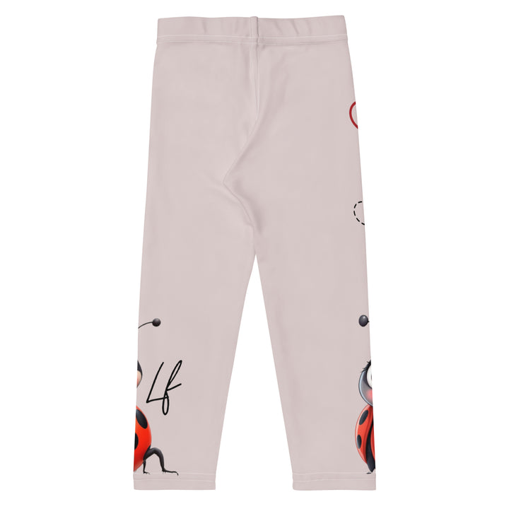 Lovebugs Girls Leggings, sand-colored background with a female ladybug with big eyes at the bottom of one leg and a male ladybug looking delighted on the other leg, with black swirling lines above them forming hearts on both sides, back view