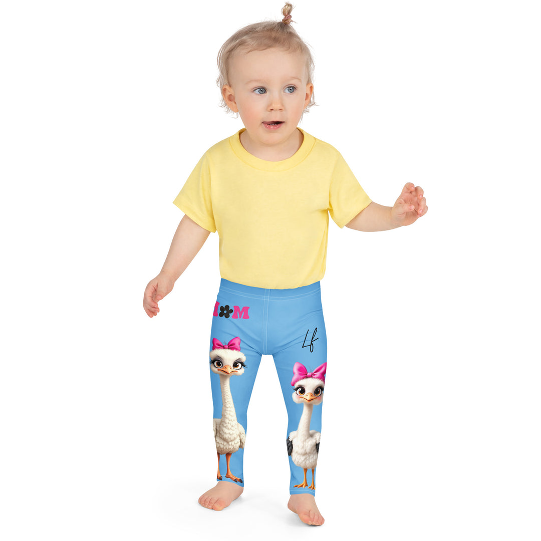Mama & Me Ostrich Girls Leggings, sky blue background with a large white mother ostrich wearing a pink bow on her head on one leg, "MOM" text in black and pink above, and a smaller white daughter ostrich with black wings and a pink bow on her head on the other leg, front close-up view on model