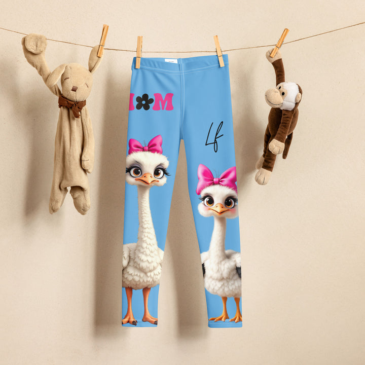 Mama & Me Ostrich Girls Leggings, sky blue background with a large white mother ostrich wearing a pink bow on her head on one leg, "MOM" text in black and pink above, and a smaller white daughter ostrich with black wings and a pink bow on her head on the other leg, front view on hanger