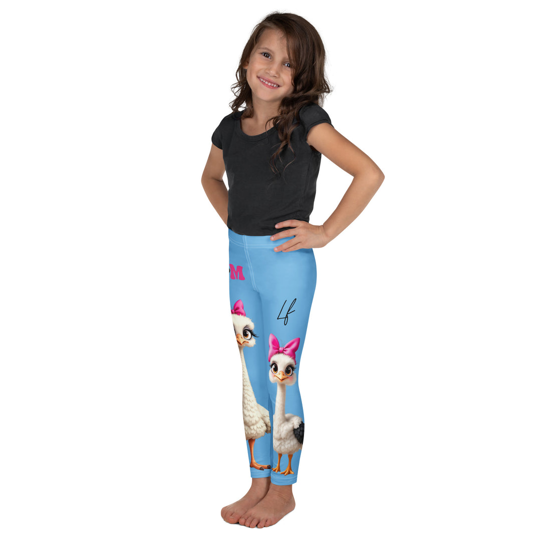 Mama & Me Ostrich Girls Leggings, sky blue background with a large white mother ostrich wearing a pink bow on her head on one leg, "MOM" text in black and pink above, and a smaller white daughter ostrich with black wings and a pink bow on her head on the other leg, left side view on model