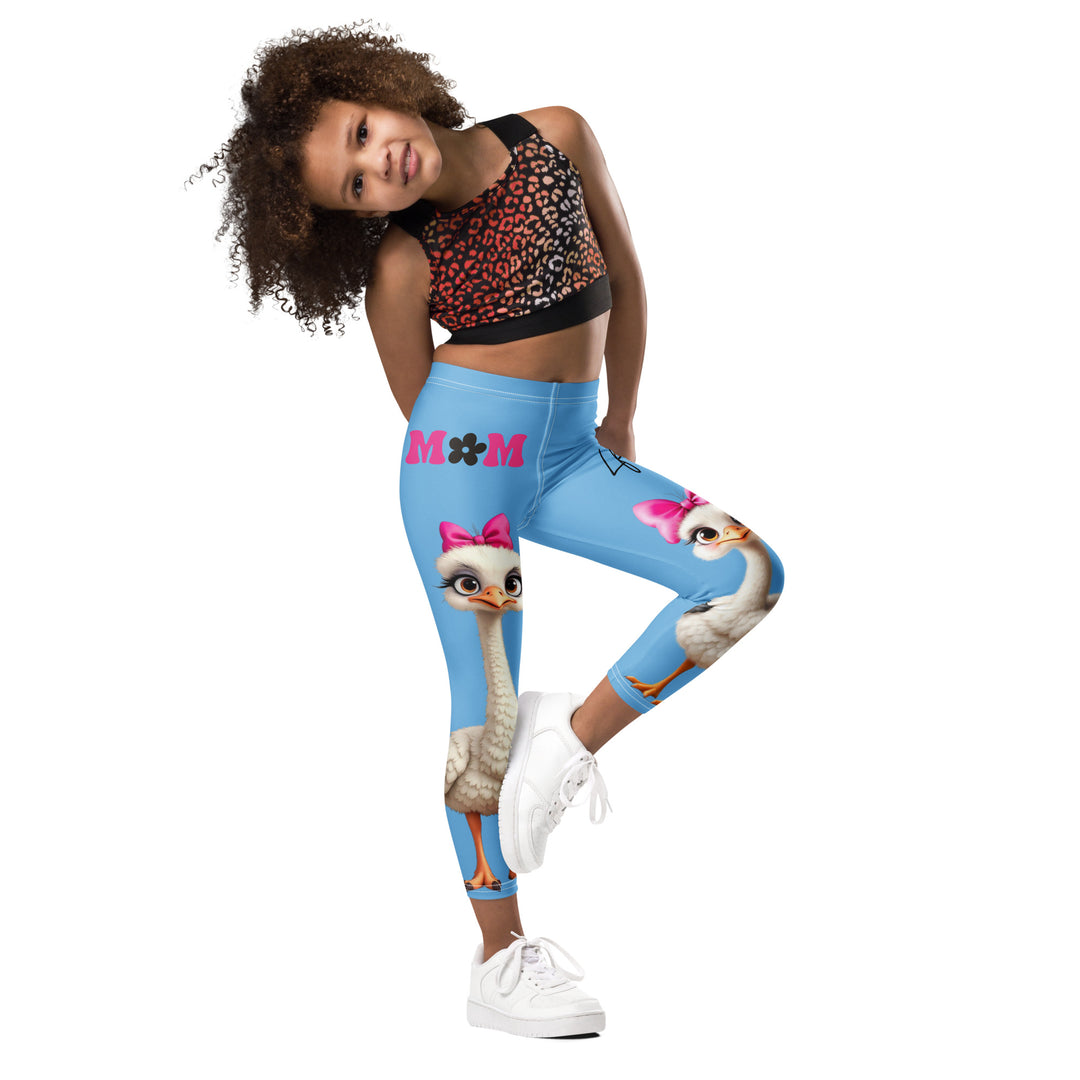  Mama & Me Ostrich Girls Leggings, sky blue background with a large white mother ostrich wearing a pink bow on her head on one leg, "MOM" text in black and pink above, and a smaller white daughter ostrich with black wings and a pink bow on her head on the other leg, side view with one leg lifted and bent on model