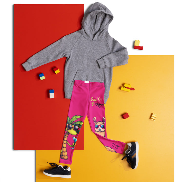 Palma Llama Girls Leggings, pink background with a palm tree wearing sunglasses and holding a cocktail on one leg, and a llama with sunglasses and "SUMMER VIBES" text above on the other leg, designs covering almost the full length of each leg, front view laid flat on floor