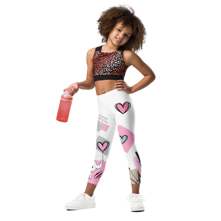 Pastel Elephant Love Girls Leggings, white background with gray elephant holding a pink heart-shaped balloon, surrounded by gray and pink hearts, pink and gray rectangles, and floral accents in matching colors, front view on model-with a visible 'Leona Fashion' text on the design
