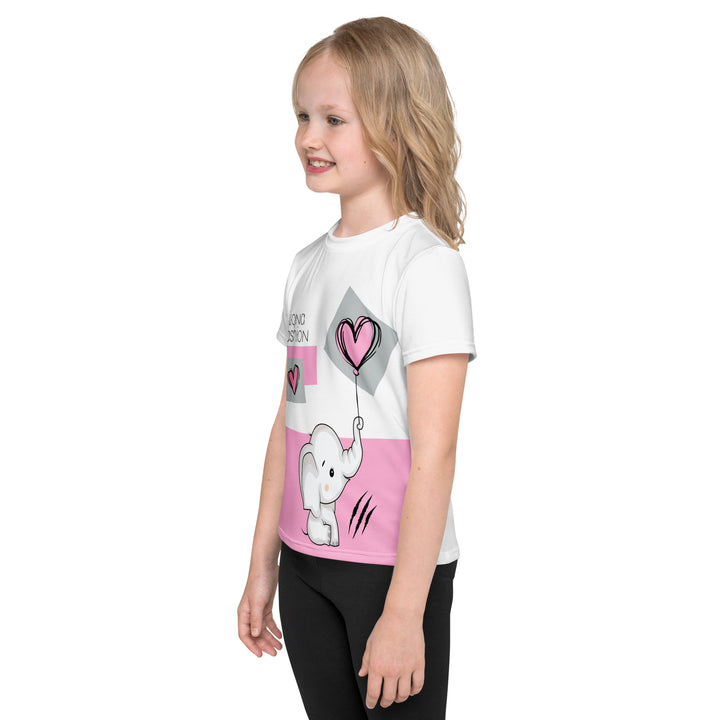  Pastel Elephant Love Girls T-shirt, white background with gray elephant holding a pink balloon, and a second pink balloon floating next to it, surrounded by pink hearts and pink and gray rectangles, left side view on model