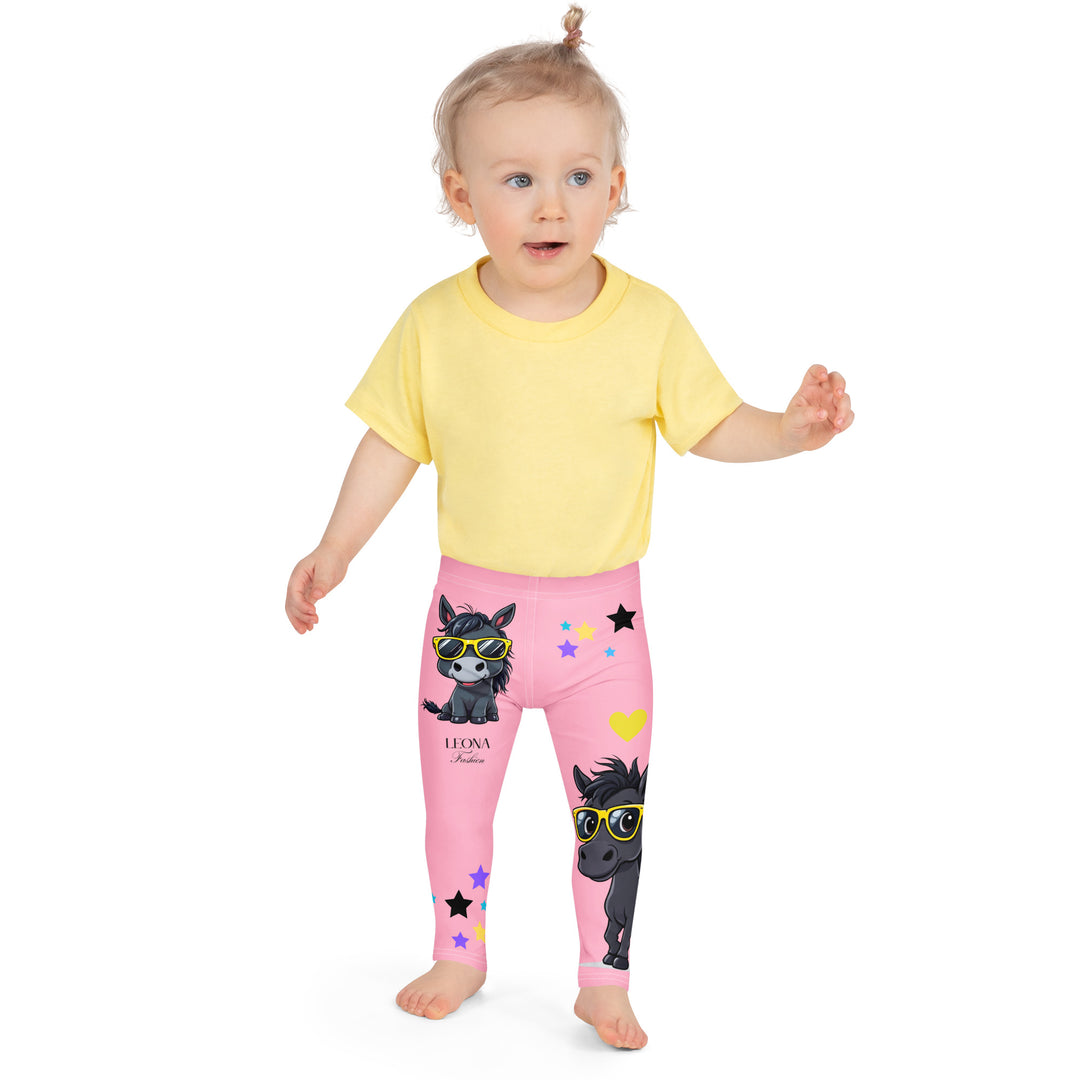 Pony Cool Girls Leggings, pink background with two black ponies wearing sunglasses and star details, front view shown on girl model-with a visible 'Leona Fashion' text on the design