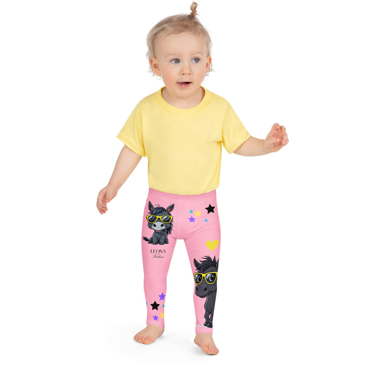 Pony Cool Girls Leggings, pink background with two black ponies wearing sunglasses and star details, front view shown on girl model-with a visible 'Leona Fashion' text on the design