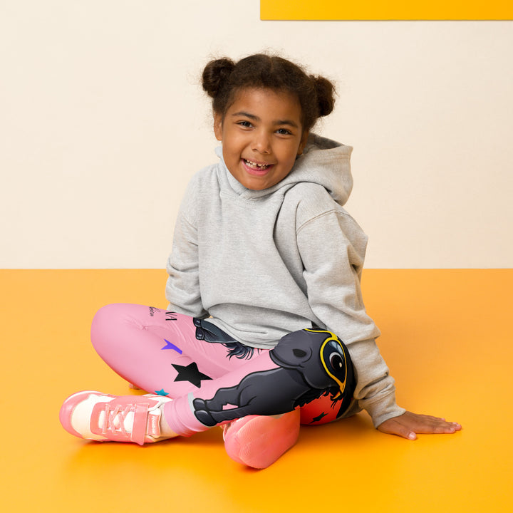 Pony Cool Girls Leggings, pink background with two black ponies wearing sunglasses and star details, front view shown on model sitting