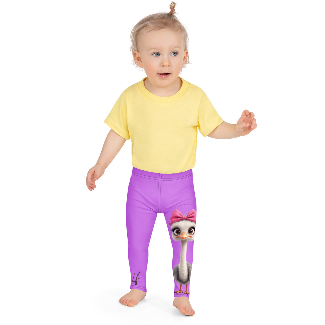 Purple Baby Ostrich Girls Leggings, purple background with a white and gray baby ostrich girl featuring a pink bow on her head extending almost the full length of one leg, front close-up view on model