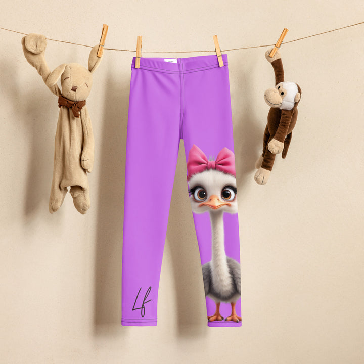 Purple Baby Ostrich Girls Leggings, purple background with a white and gray baby ostrich girl featuring a pink bow on her head extending almost the full length of one leg, front view on hanger