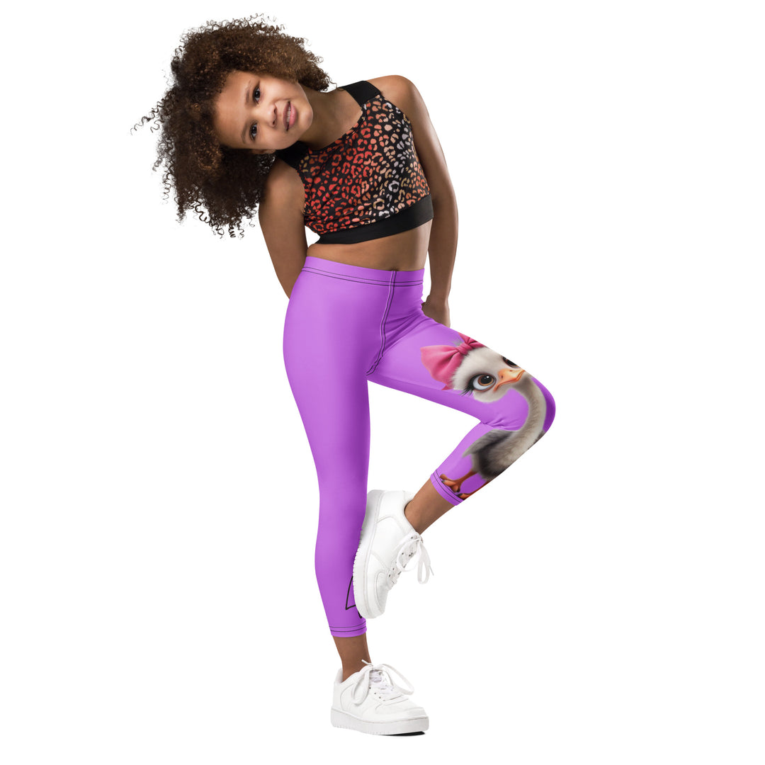  Purple Baby Ostrich Girls Leggings, purple background with a white and gray baby ostrich girl featuring a pink bow on her head extending almost the full length of one leg, side view with one leg lifted and bent on model
