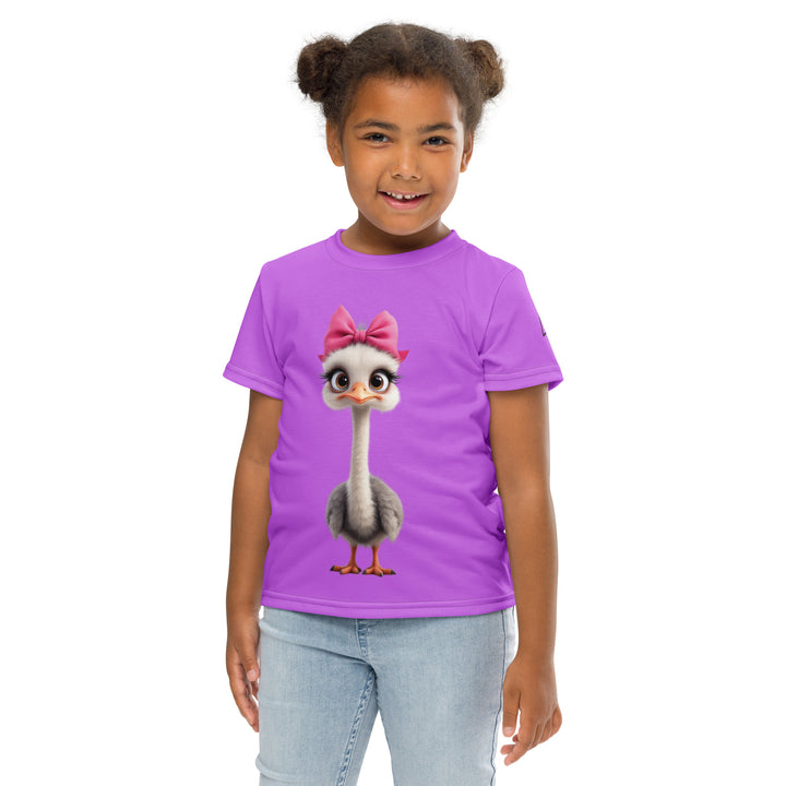 Purple Baby Ostrich Girls T-shirt, purple background with a white and gray baby ostrich girl featuring a pink bow on her head extending almost the full length of the front, front pose with arms at sides on model