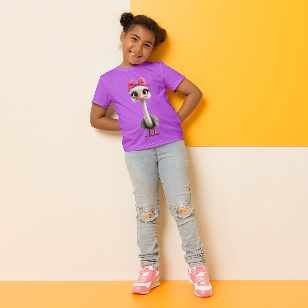 Purple Baby Ostrich Girls T-shirt, purple background with a white and gray baby ostrich girl featuring a pink bow on her head extending almost the full length of the front, relaxed front pose on model