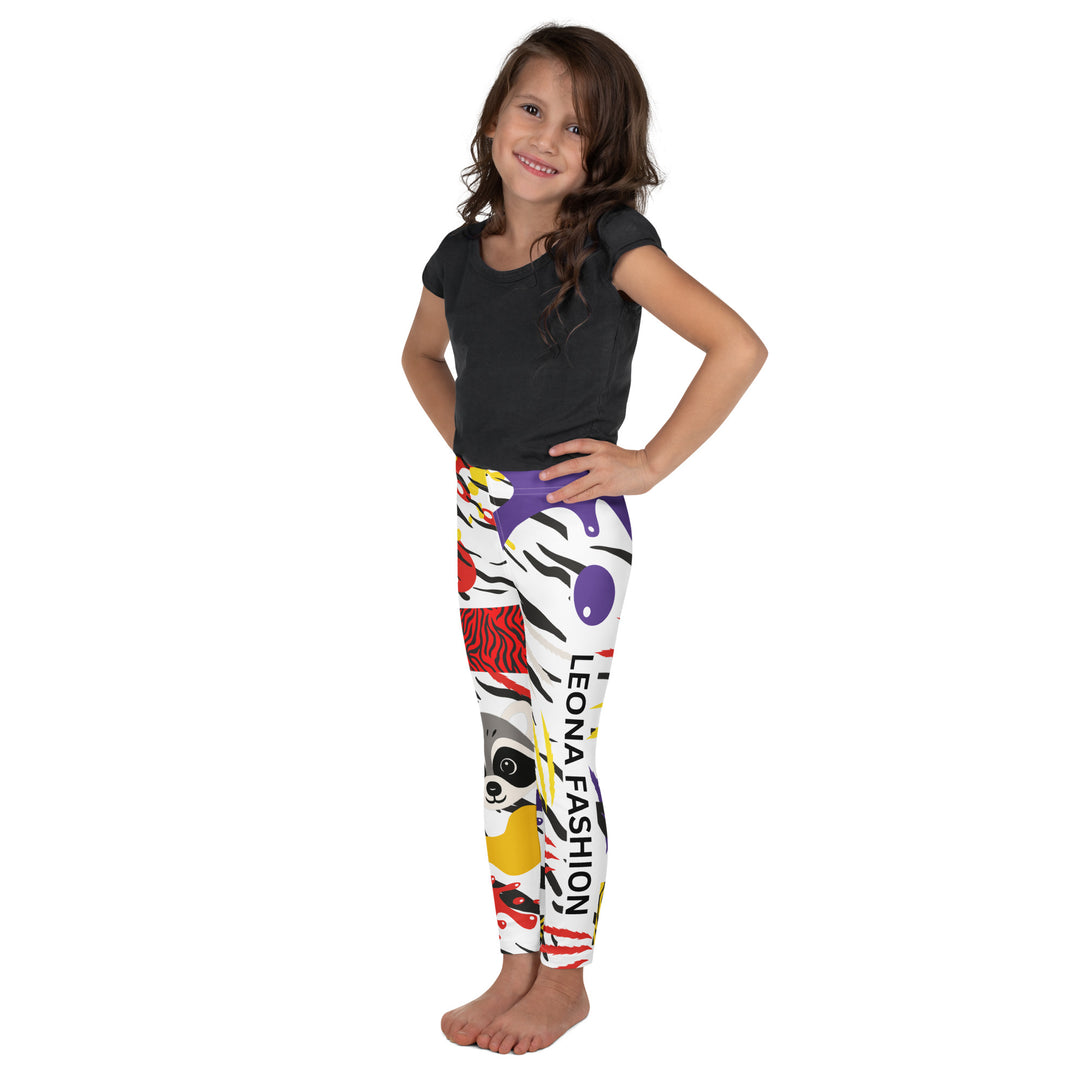  Raccoon Bandit Glow Girls Leggings, white base with splash-like spots in red, purple, and yellow, gray raccoon head, and wavy black stripes, left side view on model-with a visible 'Leona Fashion' text on the design