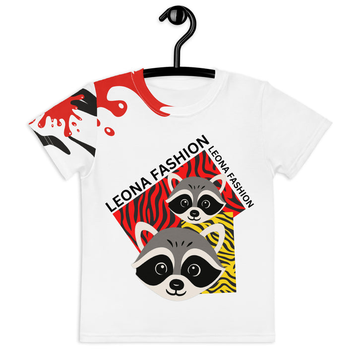  Raccoon Bandit Glow Girls T-shirt, white background with two gray raccoons inside red and yellow rectangular patterns with black stripes, red and black splash detail on right sleeve and neckline, front view on hanger-with a visible 'Leona Fashion' text on the design