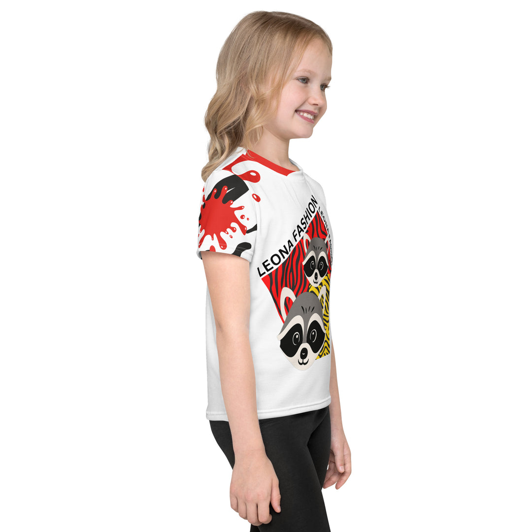  Raccoon Bandit Glow Girls T-shirt, white background with two gray raccoons inside red and yellow rectangular patterns with black stripes, red and black splash detail on right sleeve and neckline, right side view on model-with a visible 'Leona Fashion' text on the design
