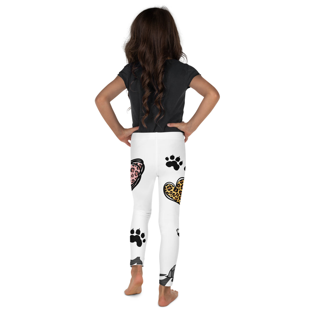 Raccoon Love Girls Leggings, white background with gray raccoon blowing a pink bubble gum sitting on a rock, pink tiger-striped heart, claws, and animal paw details, back view on model