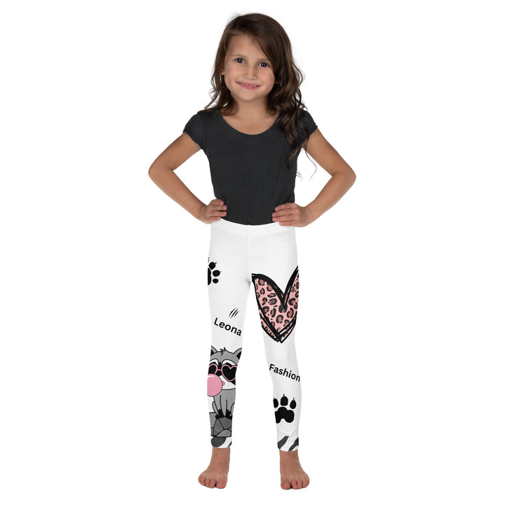 Raccoon Love Girls Leggings, white background with gray raccoon blowing a pink bubble gum sitting on a rock, pink tiger-striped heart, claws, and animal paw details, front view on model-with a visible 'Leona Fashion' text on the design