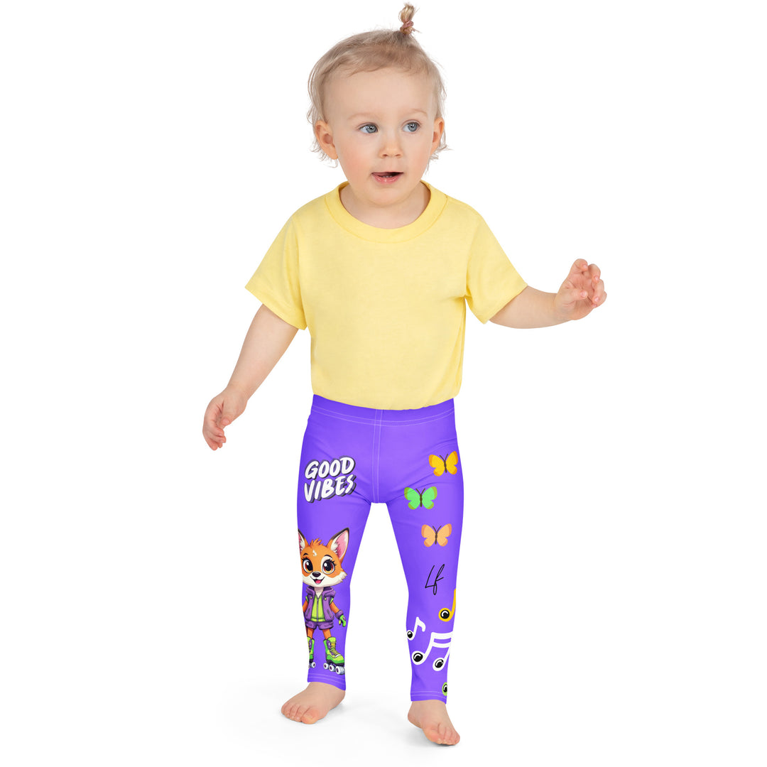 Roller Fox Girls Leggings, purple background with an orange fox wearing purple and neon green sportswear and neon green roller skates on one leg, "GOOD VIBES" text in white above, and orange-green butterflies and orange, green, and white music notes on the other leg, front close-up view on model