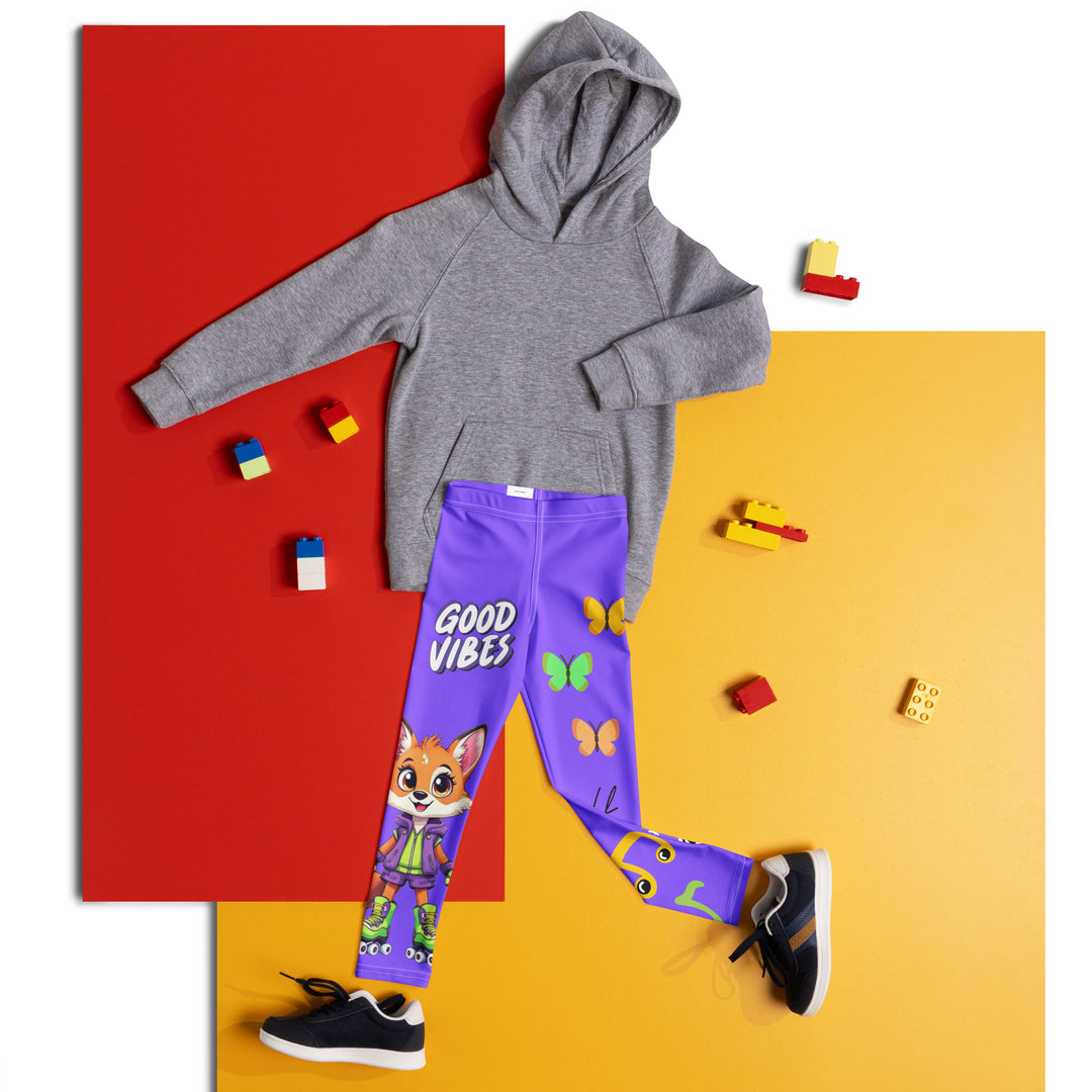  Roller Fox Girls Leggings, purple background with an orange fox wearing purple and neon green sportswear and neon green roller skates on one leg, "GOOD VIBES" text in white above, and orange-green butterflies and orange, green, and white music notes on the other leg, front view laid flat on floor