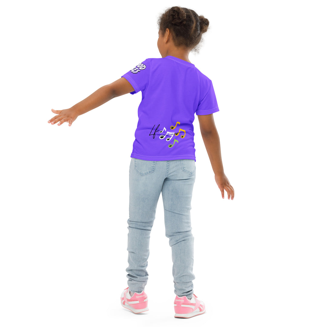 Roller Fox Girls T-shirt, purple background with an orange fox wearing purple and neon green sporty outfit and neon green roller skates on the front, "GOOD VIBES" text in white on the left sleeve, and purple, green, and white music notes on the back, back angle with relaxed pose on model