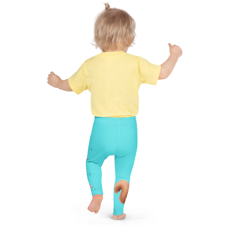 Skate Squirrel Girls Leggings, pastel blue background with a squirrel wearing a pink dress and ice skates on one leg, pastel pink and blue hearts with pink skates on the other leg, and black sparkling star details winding between the elements, back pose on model