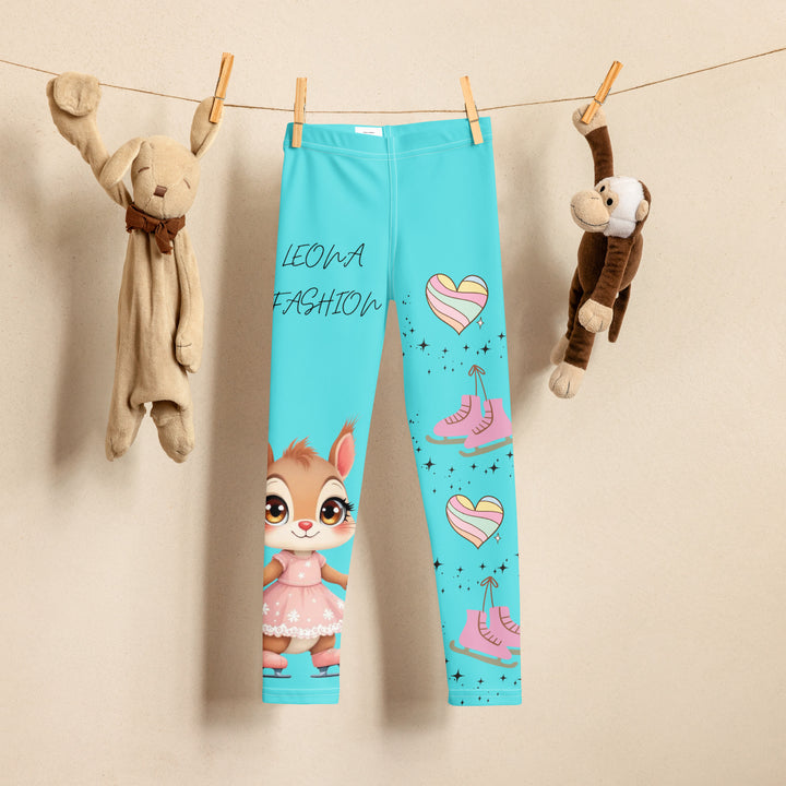 Skate Squirrel Girls Leggings, pastel blue background with a squirrel wearing a pink dress and ice skates on one leg, pastel pink and blue hearts with pink skates on the other leg, and black sparkling star details winding between the elements, front view on hanger-with a visible 'Leona Fashion' text on the design