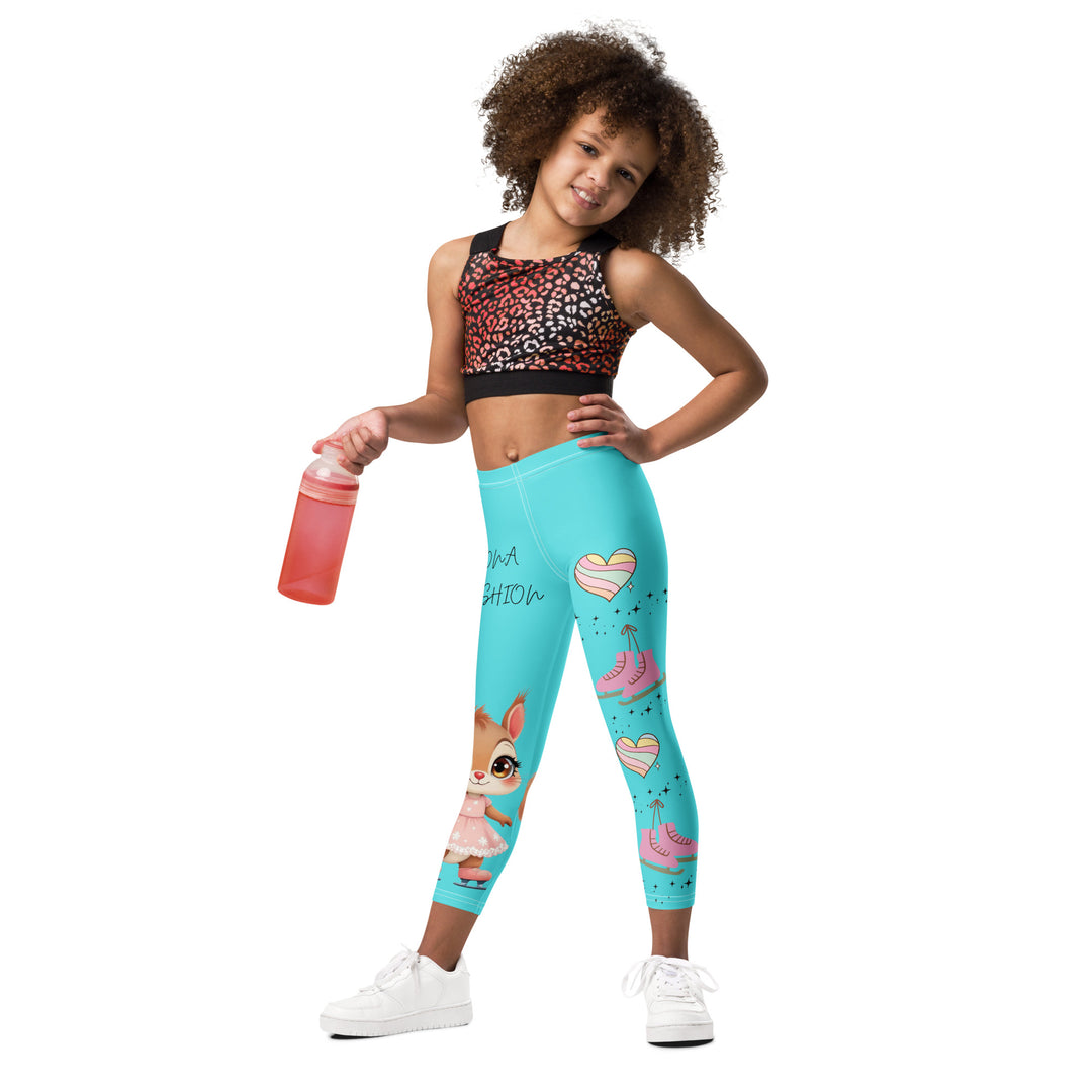 Skate Squirrel Girls Leggings, pastel blue background with a squirrel wearing a pink dress and ice skates on one leg, pastel pink and blue hearts with pink skates on the other leg, and black sparkling star details winding between the elements, relaxed front pose on model