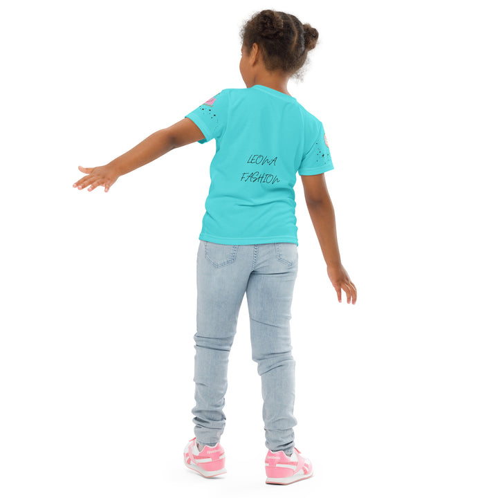 Skate Squirrel Girls T-shirt, pastel blue background with a squirrel wearing pink leggings and ice skates on the front, pink skates with small sparkling black stars on the left sleeve, and a pastel pink and blue heart with tiny sparkling black stars on the right sleeve, back angle with relaxed pose on model-with a visible 'Leona Fashion' text on the design