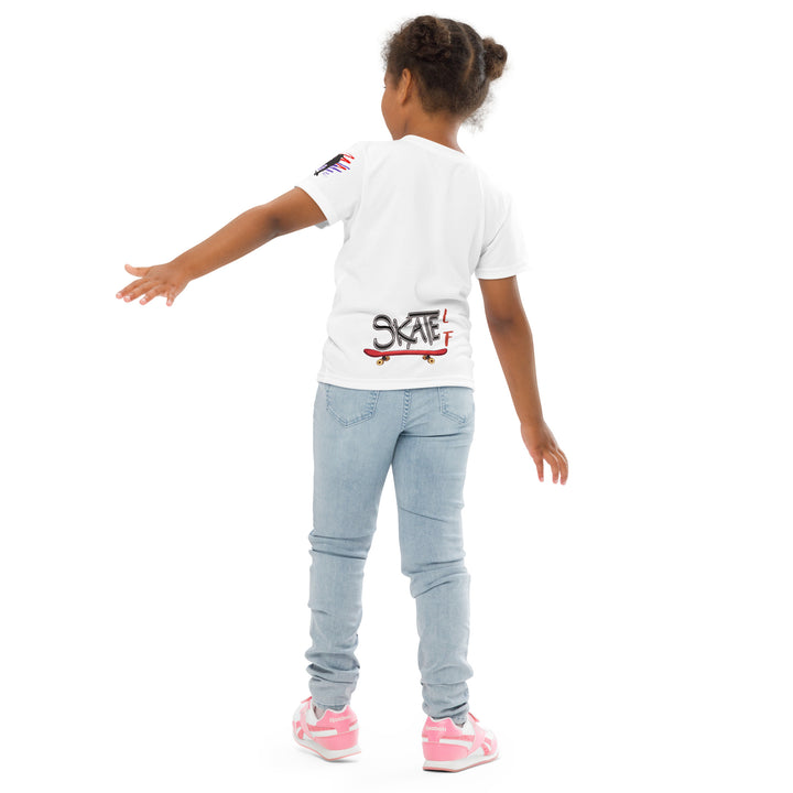 Skater Turtle Girls T-shirt, white background with a green turtle on a skateboard and black "MAKE YOUR MOVE" text on the front, black skater silhouette with pink and purple motion lines on the left sleeve, and a skateboard with "SKATE" text at the bottom back of the shirt, back pose on model