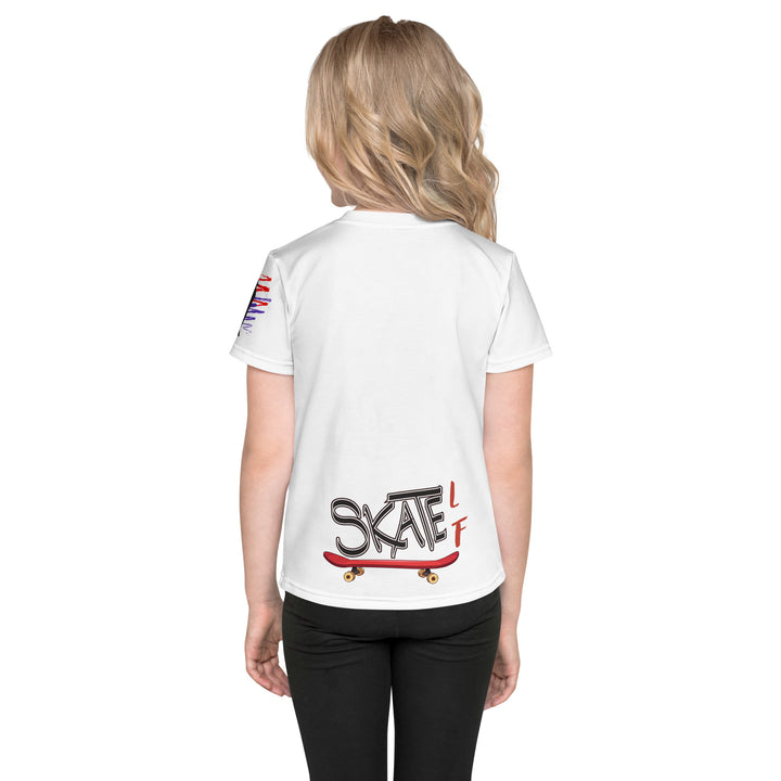  Skater Turtle Girls T-shirt, white background with a green turtle on a skateboard and black "MAKE YOUR MOVE" text on the front, black skater silhouette with pink and purple motion lines on the left sleeve, and a skateboard with "SKATE" text at the bottom back of the shirt, back view on model