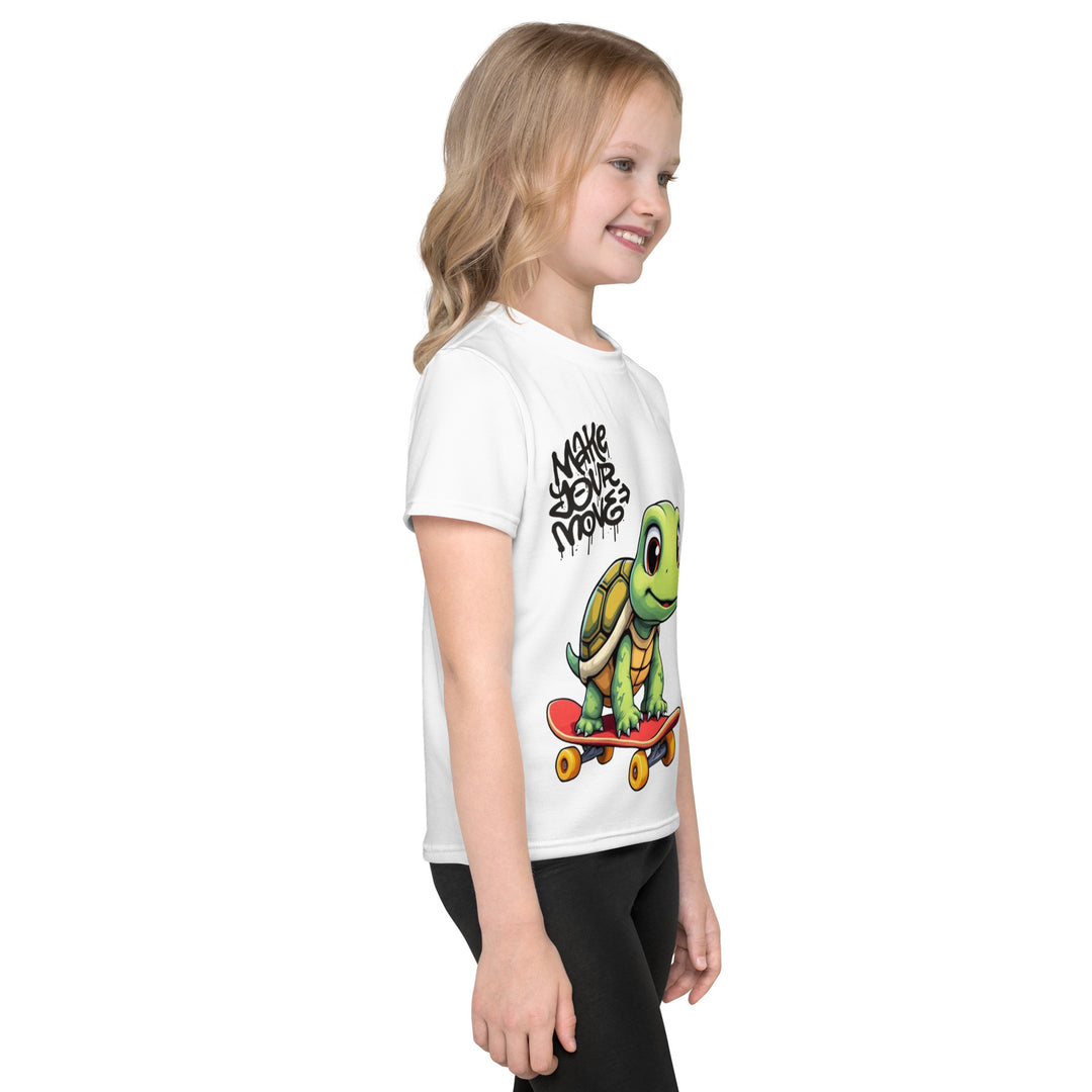  Skater Turtle Girls T-shirt, white background with a green turtle on a skateboard and black "MAKE YOUR MOVE" text on the front, black skater silhouette with pink and purple motion lines on the left sleeve, and a skateboard with "SKATE" text at the bottom back of the shirt, right side view on model