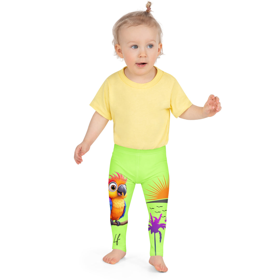  Sunset Parrot Girls Leggings, neon green background with an orange, blue, and purple parrot standing on a branch on one leg, and an orange sunset with flying birds and a purple palm tree on the other leg, front close-up view on model