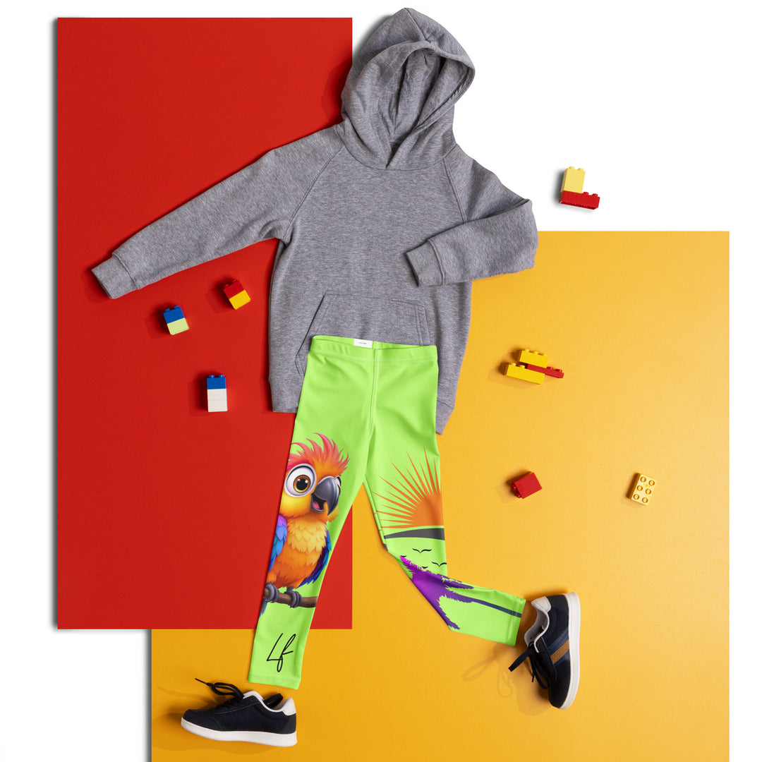 Sunset Parrot Girls Leggings, neon green background with an orange, blue, and purple parrot standing on a branch on one leg, and an orange sunset with flying birds and a purple palm tree on the other leg, front view laid flat on floor