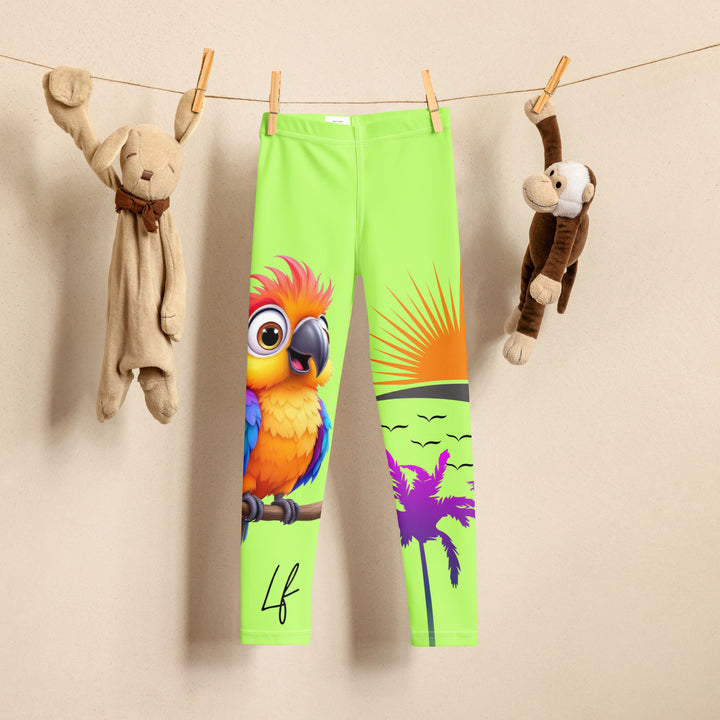  Sunset Parrot Girls Leggings, neon green background with an orange, blue, and purple parrot standing on a branch on one leg, and an orange sunset with flying birds and a purple palm tree on the other leg, front view on hanger