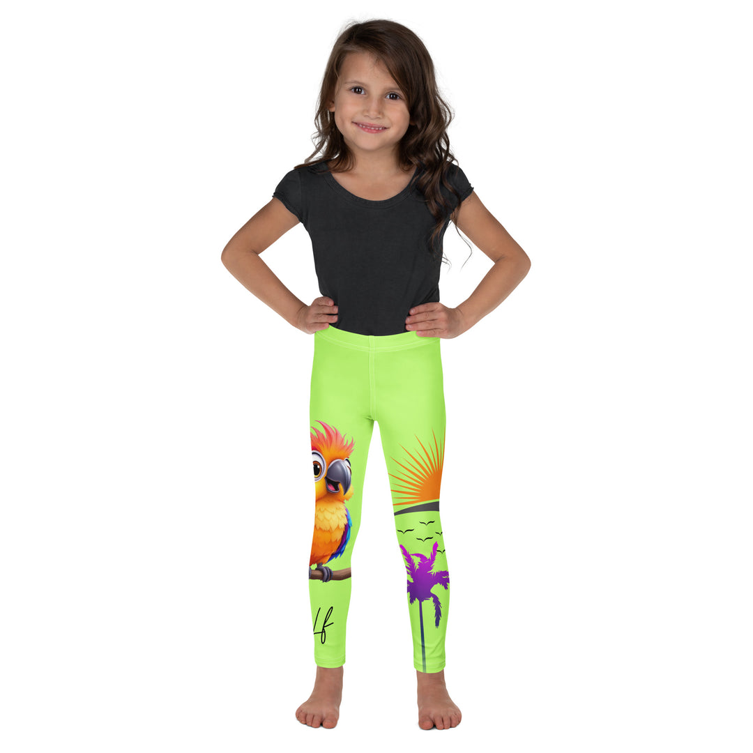 Sunset Parrot Girls Leggings, neon green background with an orange, blue, and purple parrot standing on a branch on one leg, and an orange sunset with flying birds and a purple palm tree on the other leg, front view on model
