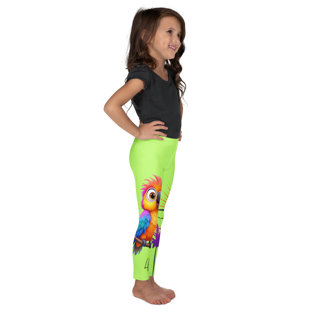 Sunset Parrot Girls Leggings, neon green background with an orange, blue, and purple parrot standing on a branch on one leg, and an orange sunset with flying birds and a purple palm tree on the other leg, right side view on model