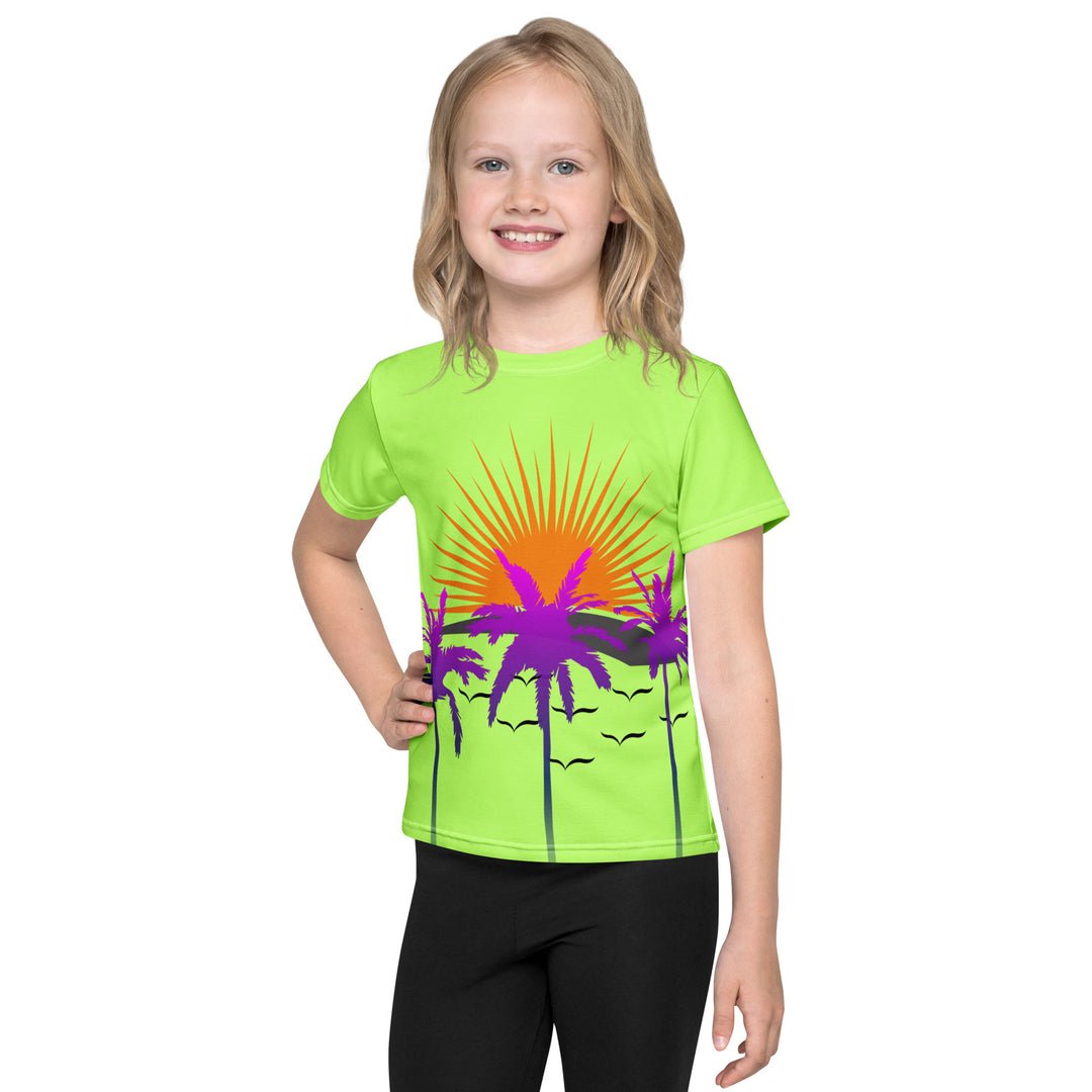  Sunset Parrot Girls T-shirt, neon green background with an orange sunset, flying birds, and three purple palm trees on the front, and an orange, purple, and blue parrot standing on a branch on the back, front view on model