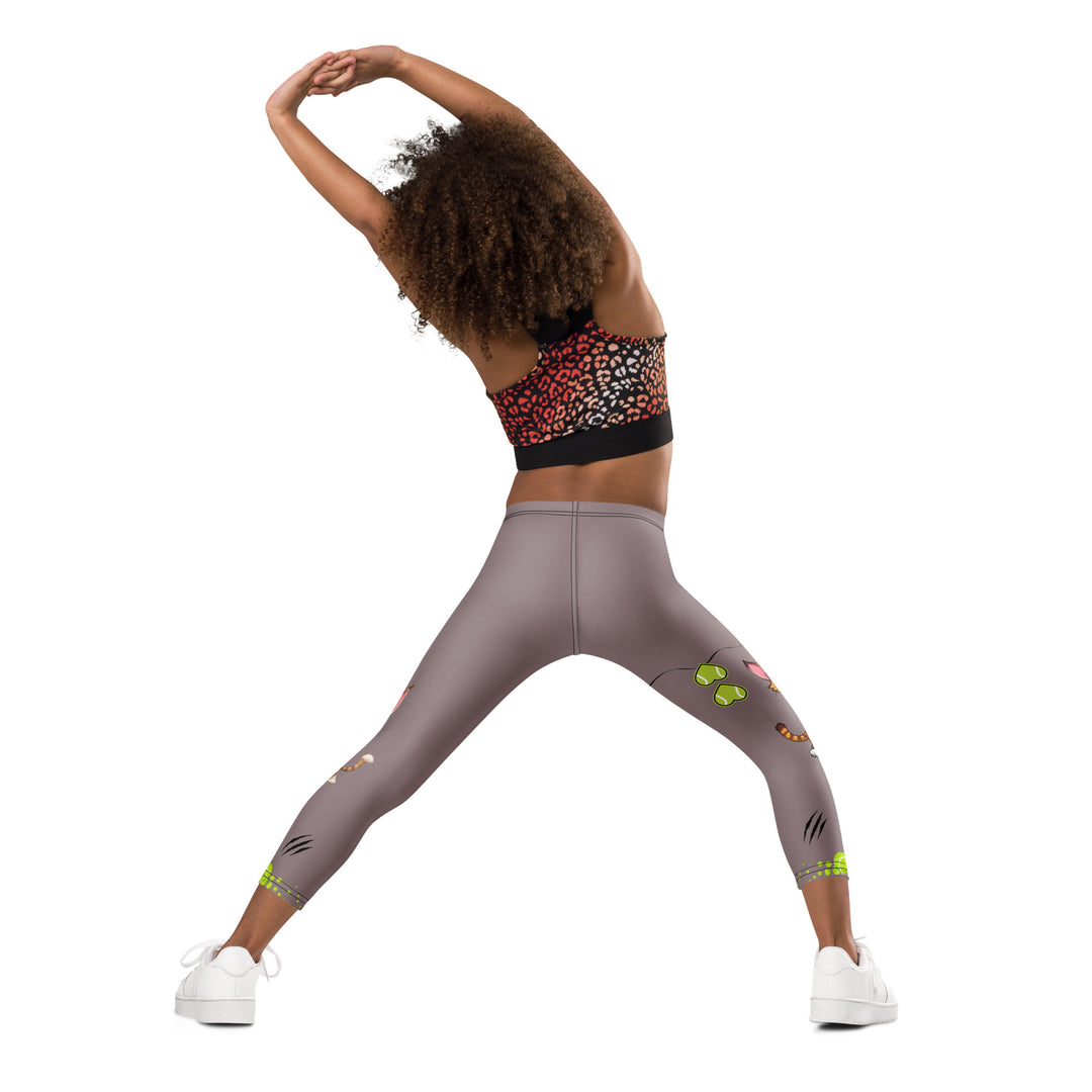  Tennis Kittens Girls Leggings, dark gray background with a cat holding a tennis racket on one leg and a kitten with a tennis racket on the other leg, each racket with a tennis ball as if playing, dressed in sporty outfits, with neon green tennis balls, hearts, and "love" text, back pose with one arm on hip on model