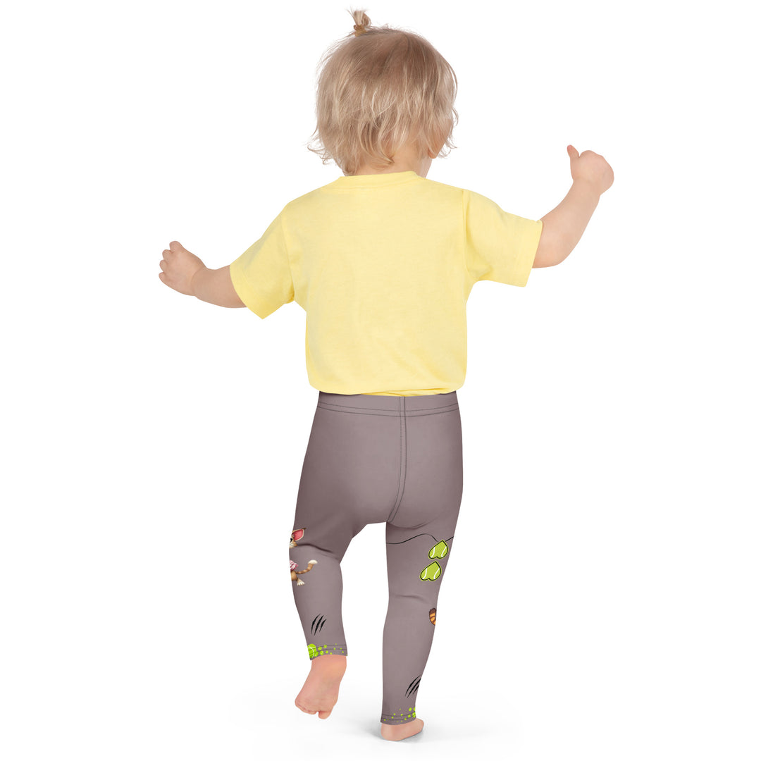 Tennis Kittens Girls Leggings, dark gray background with a cat holding a tennis racket on one leg and a kitten with a tennis racket on the other leg, each racket with a tennis ball as if playing, dressed in sporty outfits, with neon green tennis balls, hearts, and "love" text, back pose on model