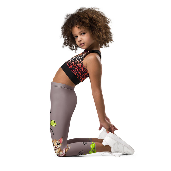 Tennis Kittens Girls Leggings, dark gray background with a cat holding a tennis racket on one leg and a kitten with a tennis racket on the other leg, each racket with a tennis ball as if playing, dressed in sporty outfits, with neon green tennis balls, hearts, and "love" text, left side view kneeling on model