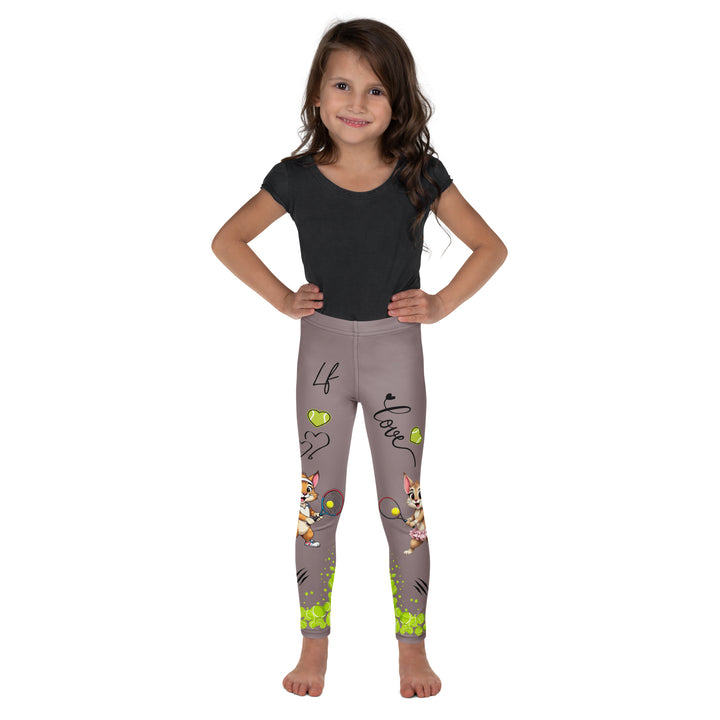 Tennis Kittens Girls Leggings, dark gray background with a cat holding a tennis racket on one leg and a kitten with a tennis racket on the other leg, each racket with a tennis ball as if playing, dressed in sporty outfits, with neon green tennis balls, hearts, and "love" text, relaxed front pose on model
